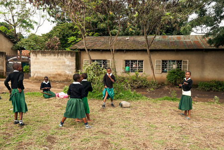 ARUSHA, TANZANIA - MAY 2014. Group of children in Africa face poor life conditions and health issues. However, they are curious, joyful and eager to play.のeditorial素材