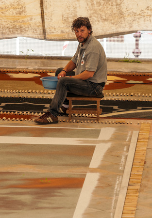 LA OROTAVA SPAIN - JUNE 2014. The people of the town working on the day of Corpus Christi in the flower carpets.のeditorial素材