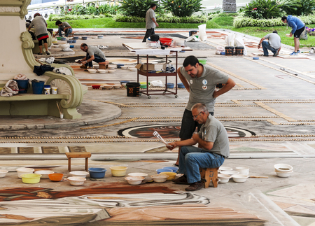 LA OROTAVA SPAIN - JUNE 2014. The people of the town working on the day of Corpus Christi in the flower carpets.のeditorial素材