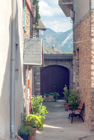 Rural village in Catalonia with the mountains of the Pyrenees in the background.の写真素材