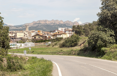 Rural village in Catalonia with the mountains of the Pyrenees in the background.の写真素材