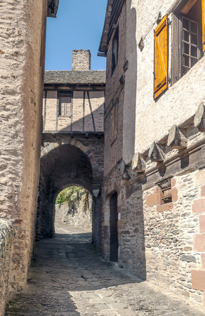 Streets of Conques in the mountains of southern France on a sunny day