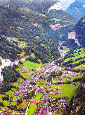 Wooden houses in the Murren mountains in Switzerland on a cloudy dayの写真素材