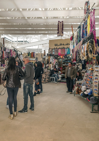 JERASH, JORDAN-FEBRUARY 2015. Person attending a store in a market of Jerash in Jordan.のeditorial素材