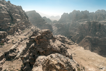 Ruins of the ancient city of Petra in Jordan. Petra is an important archaeological site in Jordan, and the capital of the ancient Nabatean kingdom, whose inhabitants called it Raqmu. Petra is not a city built with stone but, literally, excavated and sculpted in stone.の写真素材
