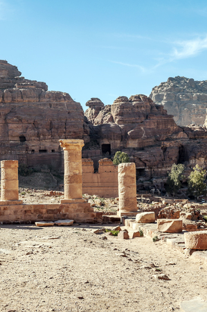 Ruins of the ancient city of Petra in Jordan. Petra is an important archaeological site in Jordan, and the capital of the ancient Nabatean kingdom, whose inhabitants called it Raqmu. Petra is not a city built with stone but, literally, excavated and sculpted in stone.の写真素材