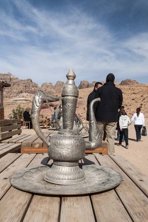 PETRA, JORDAN-FEBRUARY 2015. Tourists in Petra in Jordan .. Petra is an important archaeological site in Jordan, and the capital of the ancient Nabatean kingdom, whose inhabitants called it Raqmu. Petra is not a city built with stone but, literally, excavのeditorial素材