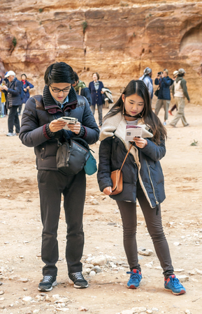 PETRA, JORDAN-FEBRUARY 2015. Tourists in Petra in Jordan .. Petra is an important archaeological site in Jordan, and the capital of the ancient Nabatean kingdom, whose inhabitants called it Raqmu. Petra is not a city built with stone but, literally, excavのeditorial素材