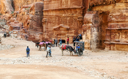 PETRA, JORDAN-FEBRUARY 2015. Tourists in Petra in Jordan .. Petra is an important archaeological site in Jordan, and the capital of the ancient Nabatean kingdom, whose inhabitants called it Raqmu. Petra is not a city built with stone but, literally, excavのeditorial素材