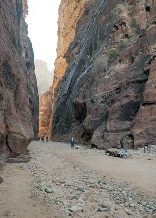 PETRA, JORDAN-FEBRUARY 2015. Tourists in Petra in Jordan .. Petra is an important archaeological site in Jordan, and the capital of the ancient Nabatean kingdom, whose inhabitants called it Raqmu. Petra is not a city built with stone but, literally, excavのeditorial素材