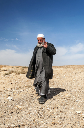 WADI RUM, JORDAN-FEBRUARY 2015. Solitary Arab man walking through the desert.のeditorial素材