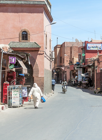 MARRAKESH, MOROCCO - JULY 2015. Streets of Marrakesh with anonymous people walking through them. The city has the largest traditional market in the country and one of the busiest squares in Africa and the world. It possesses numerous monuments heritage ofのeditorial素材
