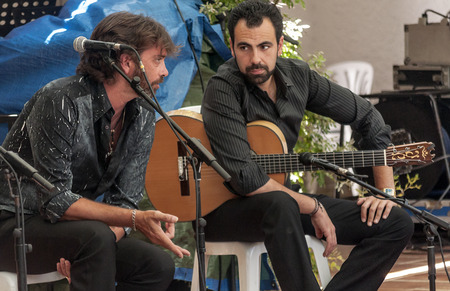 SEVILLA, ANDALUSIA, SPAIN-JULY 2015. Anonymous people singing and dancing at the Seville fair in Spain on a sunny dayのeditorial素材