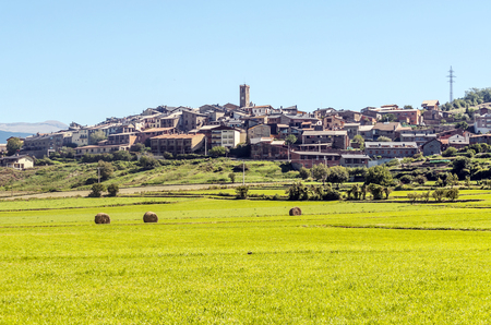 Rural village in the north of Spain surrounded by cultivated fields on a sunny day.の写真素材