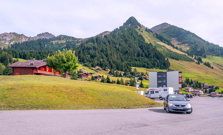 BERNE, SWITZERLAND-SEPTEMBER 2015. Cars circulating around the Swiss city of Bern on a sunny day. It is surrounded by the mountains of the Alps.のeditorial素材