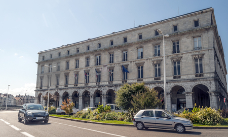 Bayonne, France-September 2015.Bayona is a city in the French Basque Country, at the confluence of the Nive and Adur rivers, in the southwest of France. You see people walking through the streets and cars driving along the road.のeditorial素材