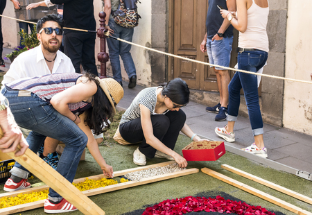 LA OROTAVA CANARY ISLAND SPAIN - JUNE 2016. The people of the town working on the day of Corpus Christi in the flower carpets.のeditorial素材