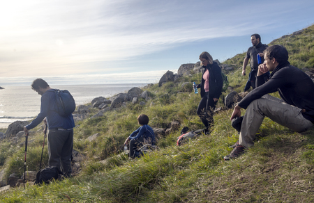 Lofoten, Nordland, Norway-September 2016. Tourists in the Lofoten mountains in Norway on a cloudy day. The Lofoten Islands are an archipelago and a district of Norway, located in the province of Nordland, above the Arctic Circle.のeditorial素材