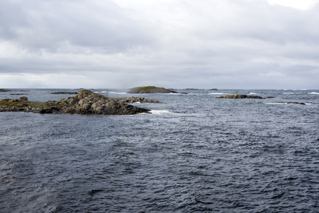 Mountains by the sea in Lofoten, Norway on a cloudy day