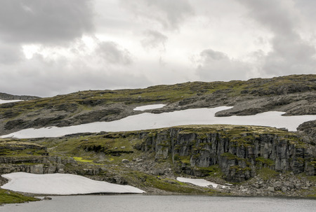Lake in the prairies of the interior of southern Norway on a cloudy day.の写真素材