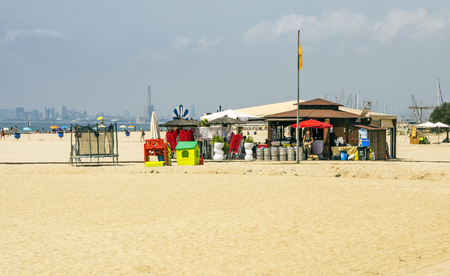 Alella, Barcelona, Spain-June 20017. Alella beach with people bathing. Alella is a municipality of Catalonia. Belonging to the province of Barcelona, in the Maresme region. The town is located in a mountainous area, about 2 kilometers from the sea and aboのeditorial素材