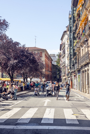 Pamplona, Navarra, Spain-September 2018. Streets of Pamplona in Navarre with people walking and buildings on both sides. Pamplona, capital of the province of Navarra, is a city in northern Spain. It is known mainly for the celebration of bullfights (feastのeditorial素材