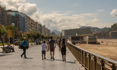 SAN SEBASTIAN, SPAIN - SEPTEMBER 2018. Streets next to the beach of La Concha in San Sebastian with people walking in them.のeditorial素材