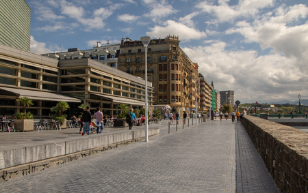 SAN SEBASTIAN, SPAIN - SEPTEMBER 2018. Streets next to the beach of La Concha in San Sebastian with people walking in them.のeditorial素材