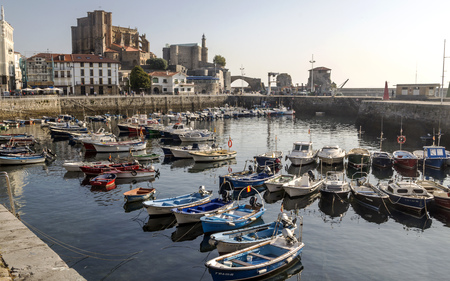 Castro Urdiales, Spain-Septemeber 2018. View of a coast city in spain with boats in the sea.のeditorial素材