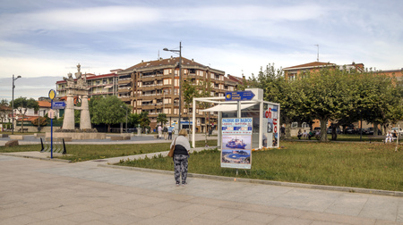 Castro Urdiales, Spain-Septemeber 2019. People and tourist walking in the promenade with big building in one side.のeditorial素材