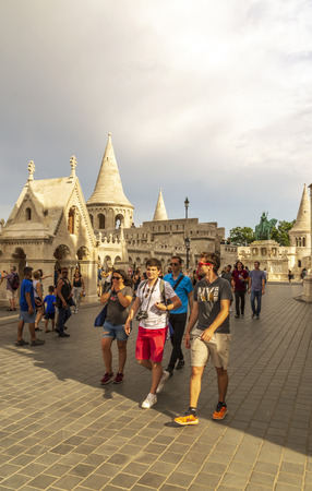 Budapest, Hungary - June 2019.  Street of Budapest in vertical in a cloudy day. You can see the tourist walking in them doing a touristic travel.のeditorial素材