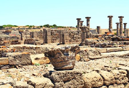 Roman Forum with several stones is located in the ruins of Baelo Claudia in the Spanish province of Cadiz Roman Forum with several stones is located in the ruins of Baelo Claudia in the Spanish province of Cadiz near the beach in a sunny dayの写真素材