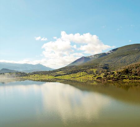 Lake with mountains in Andalusia in a sunny day in the south of Spainの写真素材