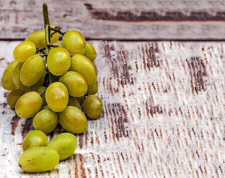 Grapes surrounded by rustic backgroundの写真素材