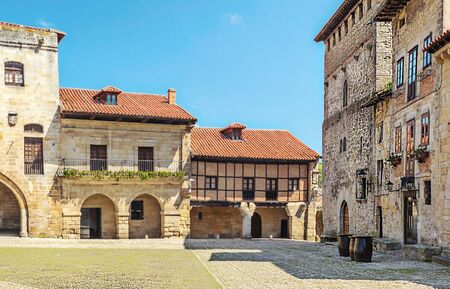 Village of Santillana del Mar in northern Spain in a cloudy dayの写真素材