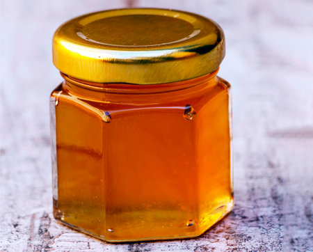 Honey with nuts surrounded by rustic backgroundの写真素材