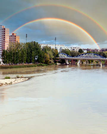 Zaragoza in the north of Spain near the river in a cloudy dayの写真素材