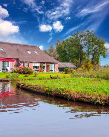 Water canal in Netherland on a cloudy dayの写真素材