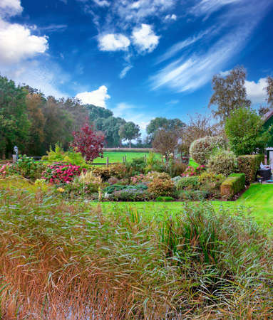 Giethoorn, village of Holland with canals and rural houses on a cloudy dayの写真素材