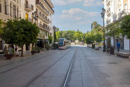 SEVILLA, SPAIN - JULY 2021. Tourist walking in the street of sevilla in tue south of Spain in a...