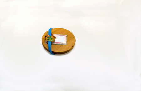 Blue ribbon in a card surrounded by wite background