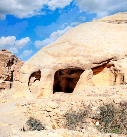 Ruins of the ancient city of Petra in Jordan in a sunny day. Petra is an important archaeological site built with stone.の写真素材