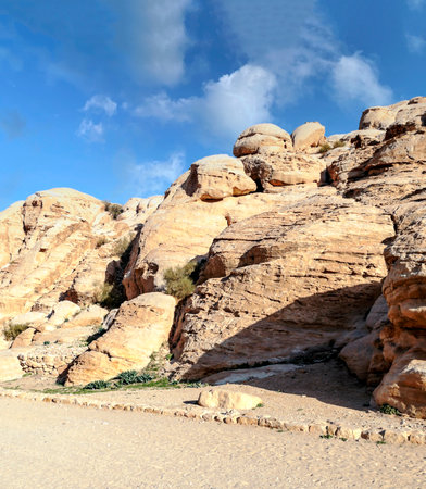 Ruins of the ancient city of Petra in Jordan in a sunny day. Petra is an important archaeological site built with stone but.の写真素材