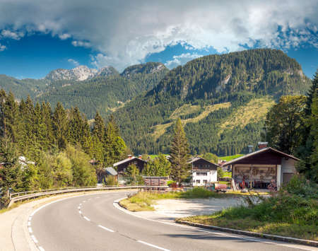 Village of Gosau with its wooden houses in the Alps of Austria on a cloudy day.