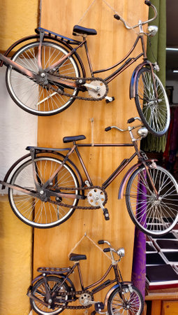 Ancient bicycle in a wall of a shop