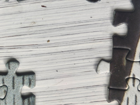 Jigsaw puzzle pieces on a piece of paper. Abstract background.の写真素材