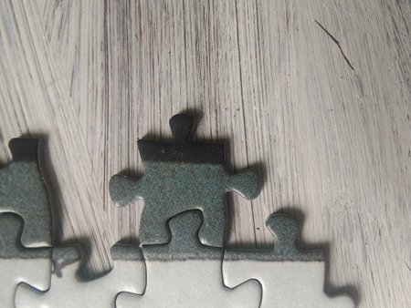Jigsaw puzzle piece with missing piece on wooden background. business conceptの写真素材