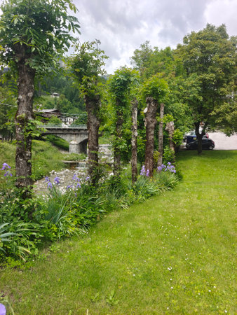 A bridge over a river in the village of Garmisch-Partenkirchenの写真素材