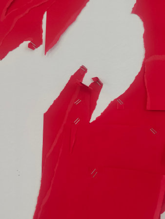 Red torn paper with space for your own text. Abstract background.の写真素材