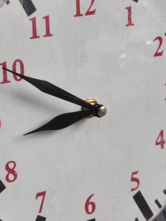 Clock marking the hourswith red numbers